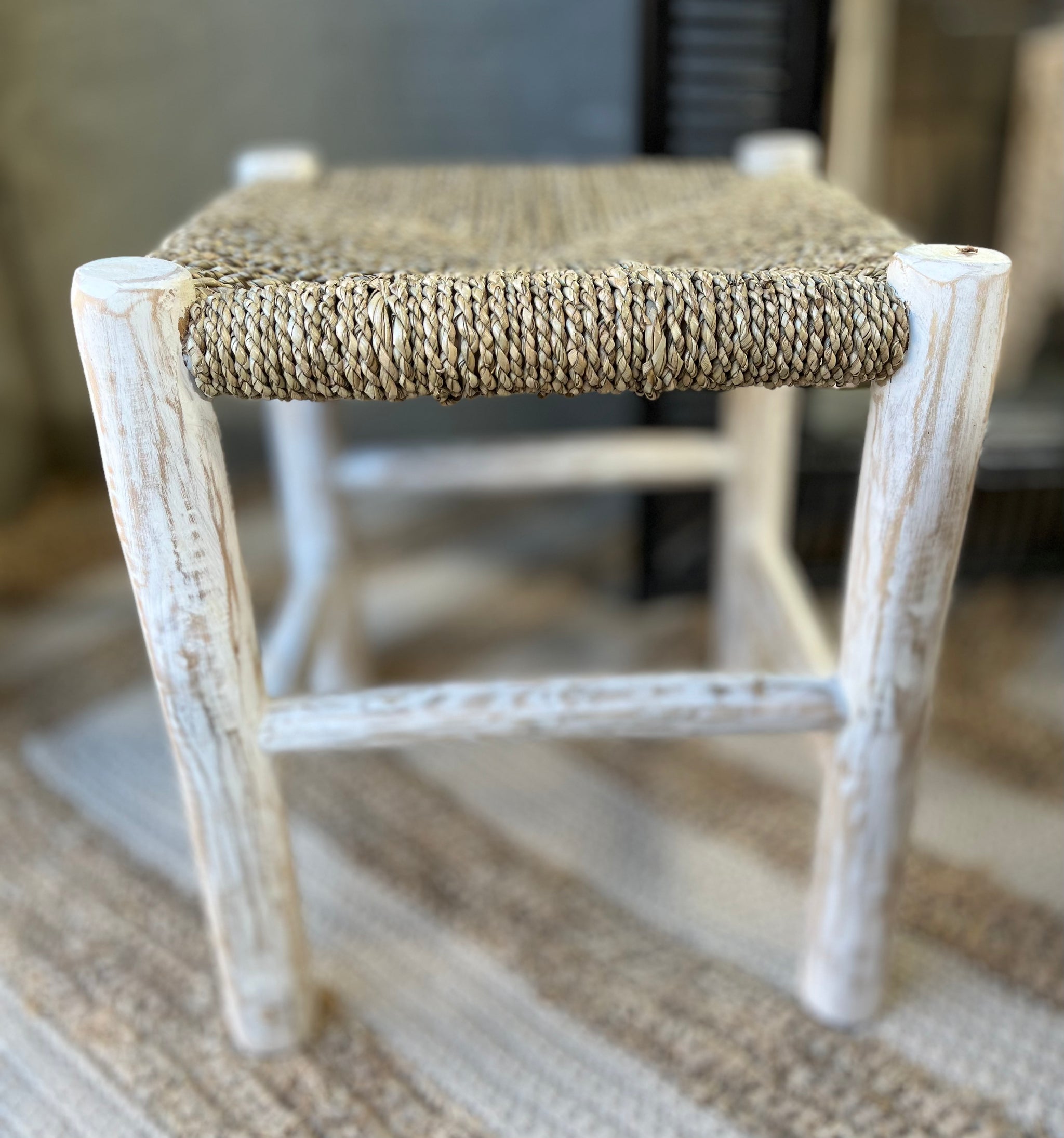 Square natural woven stool /side table with white timber legs.