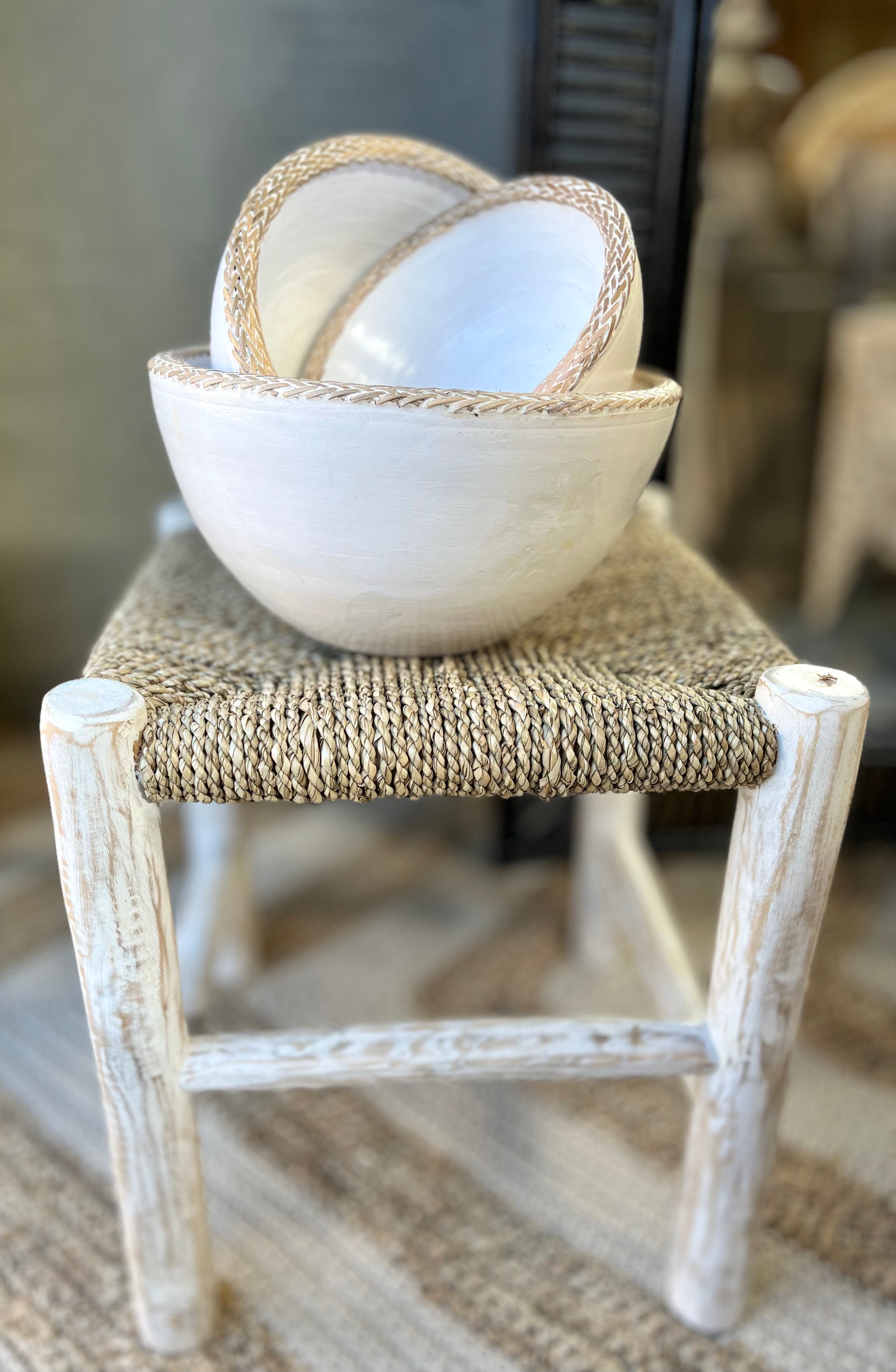 Square natural woven stool /side table with white timber legs.
