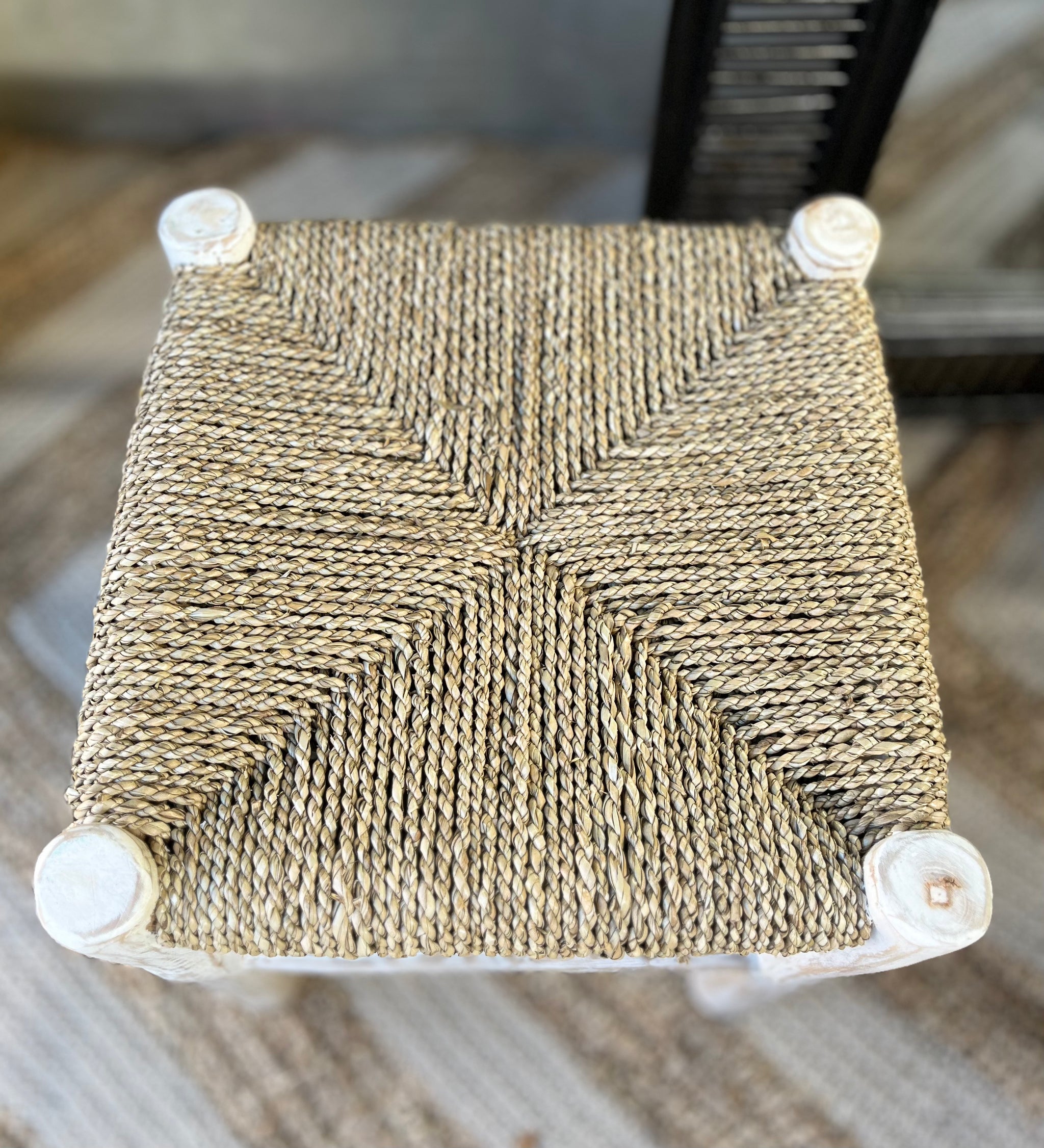 Square natural woven stool /side table with white timber legs.