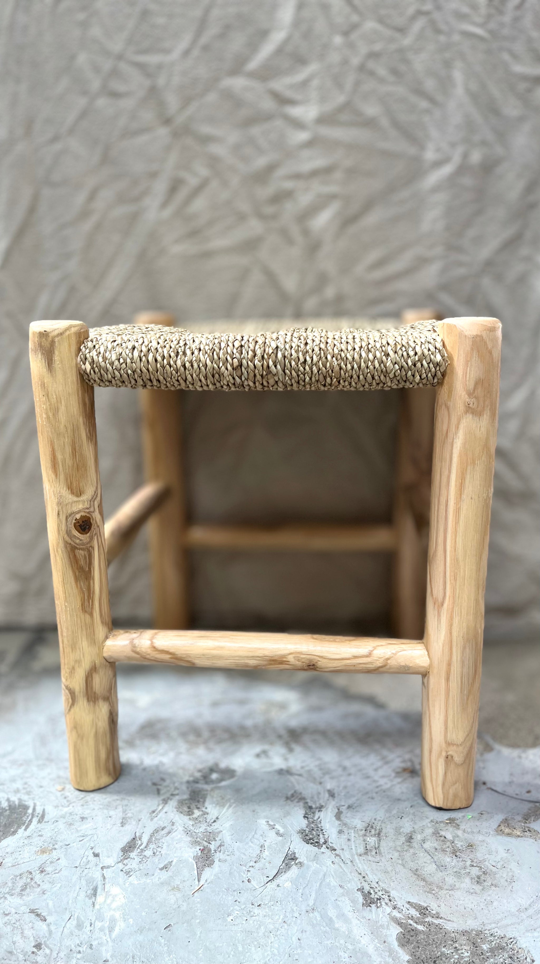 Square natural woven stool /side table with natural timber legs.