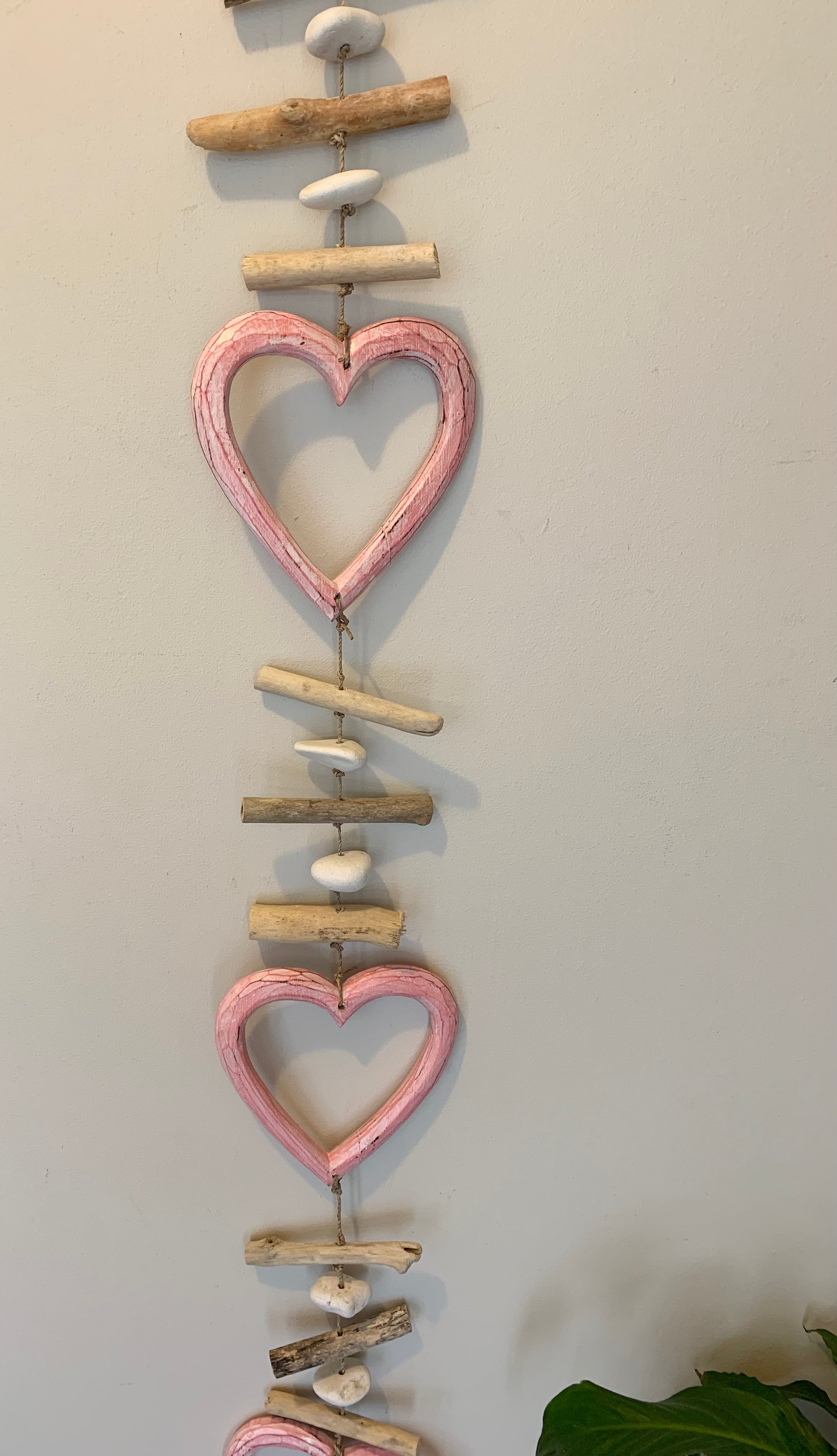 Pink timber heart hanging.