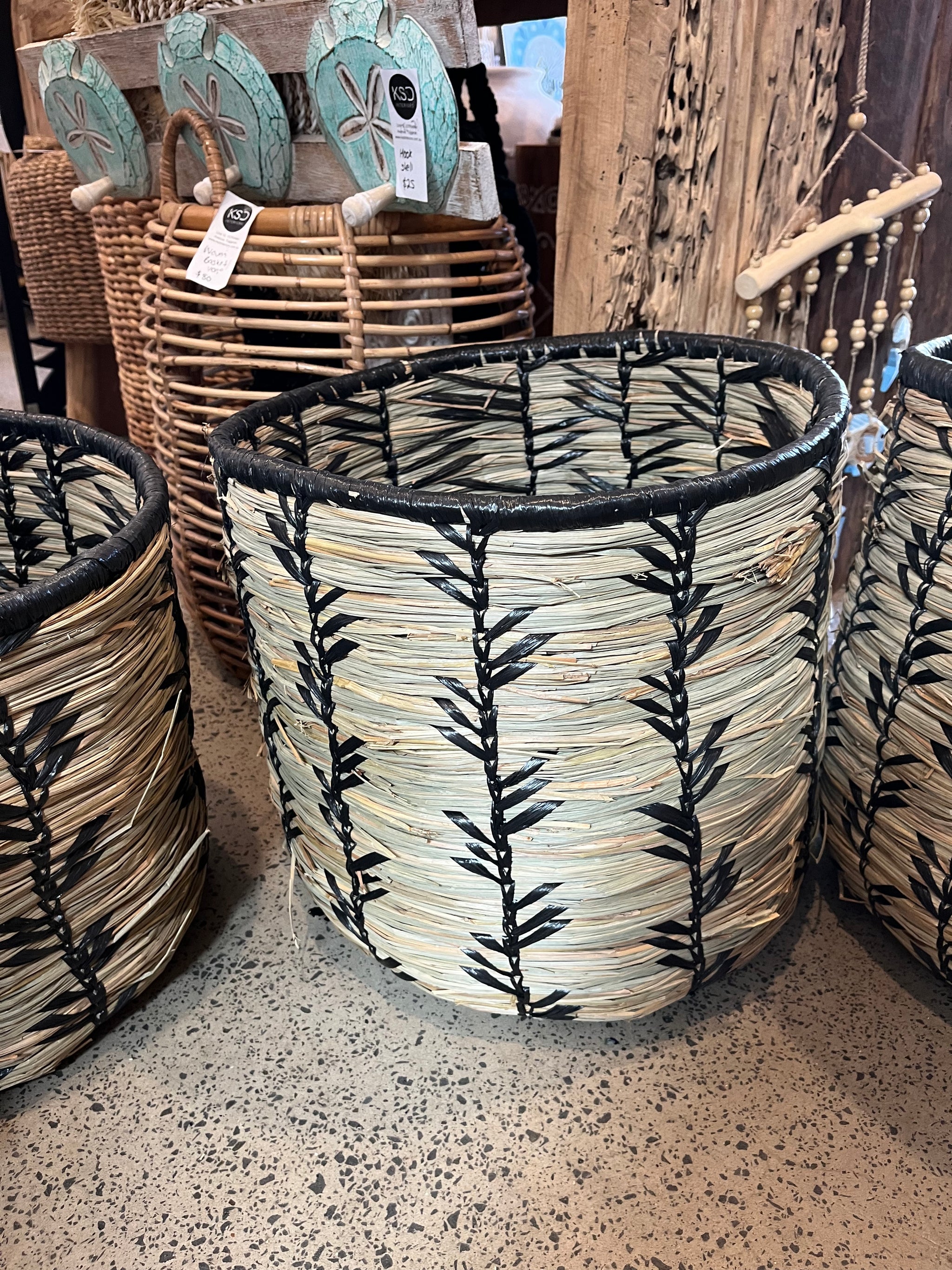 Set 3 woven baskets with natural/ black detail.