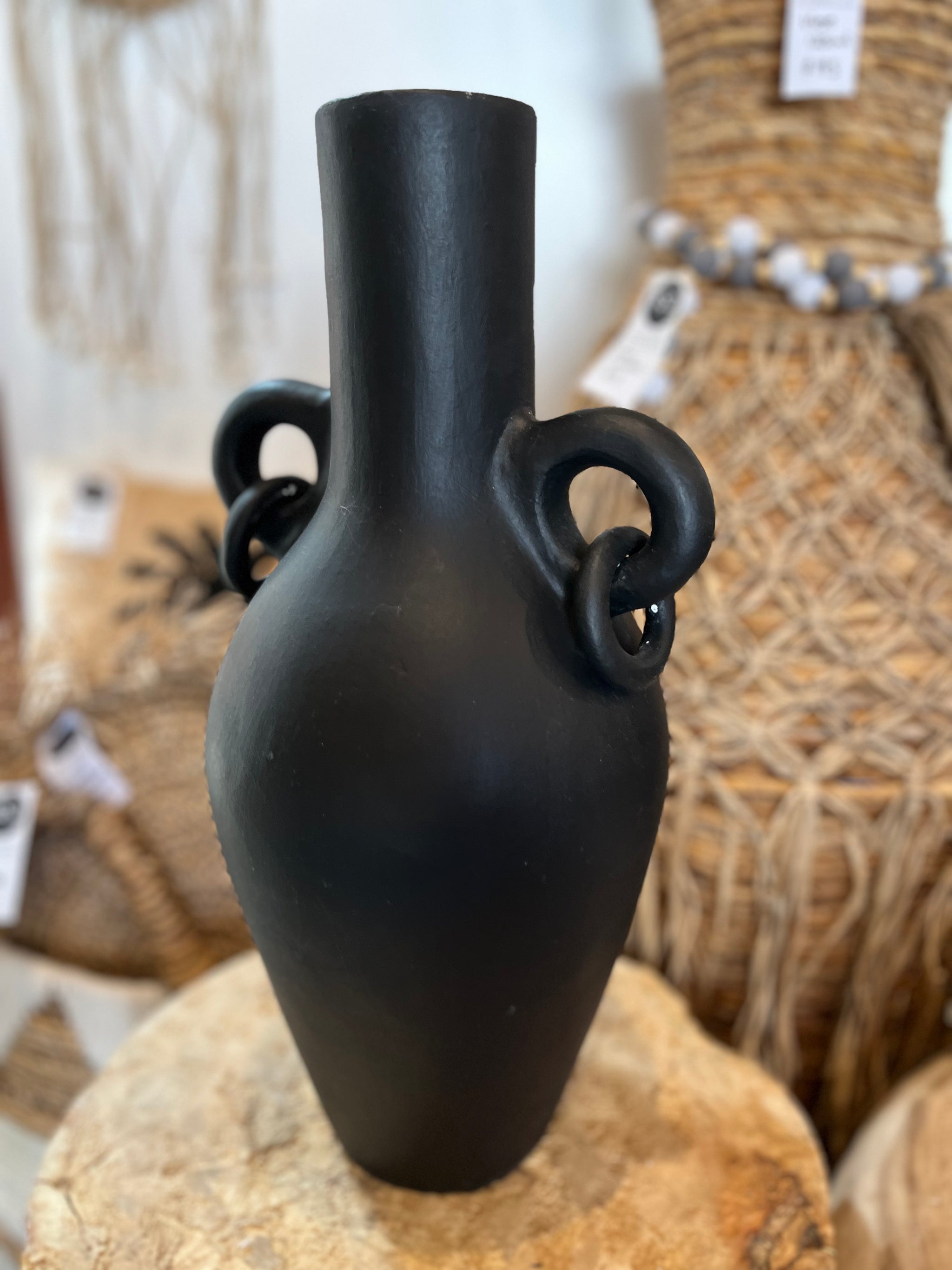 Black terracotta vase with ring handle detail