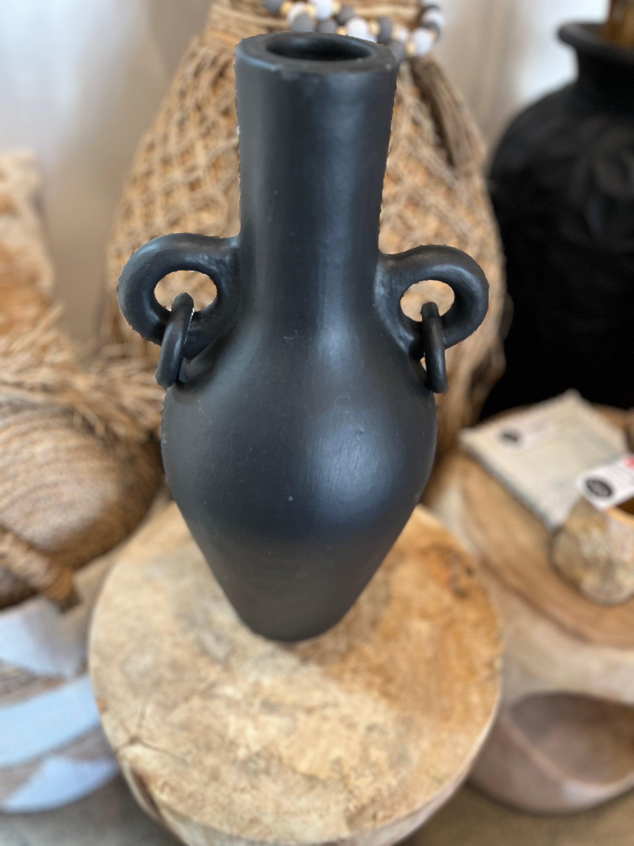 Black terracotta vase with ring handle detail