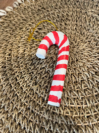 Handcrafted and handpainted timber Christmas candy cane decoration. Red and white.