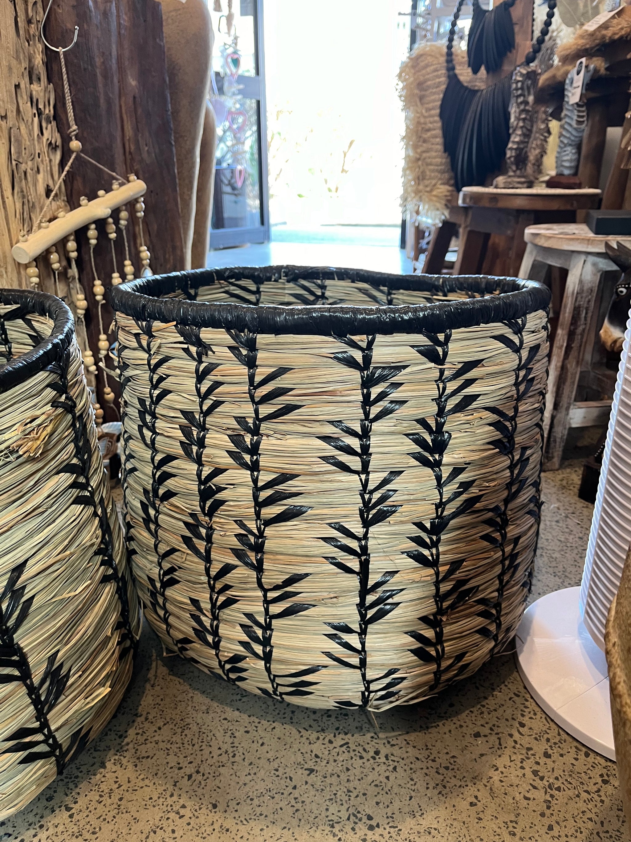 Set 3 woven baskets with natural/ black detail.