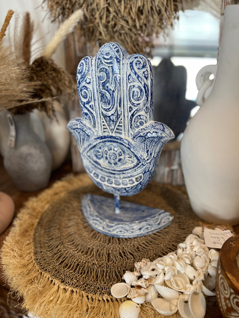 Hamsa handcarved hand. Blue. On stand