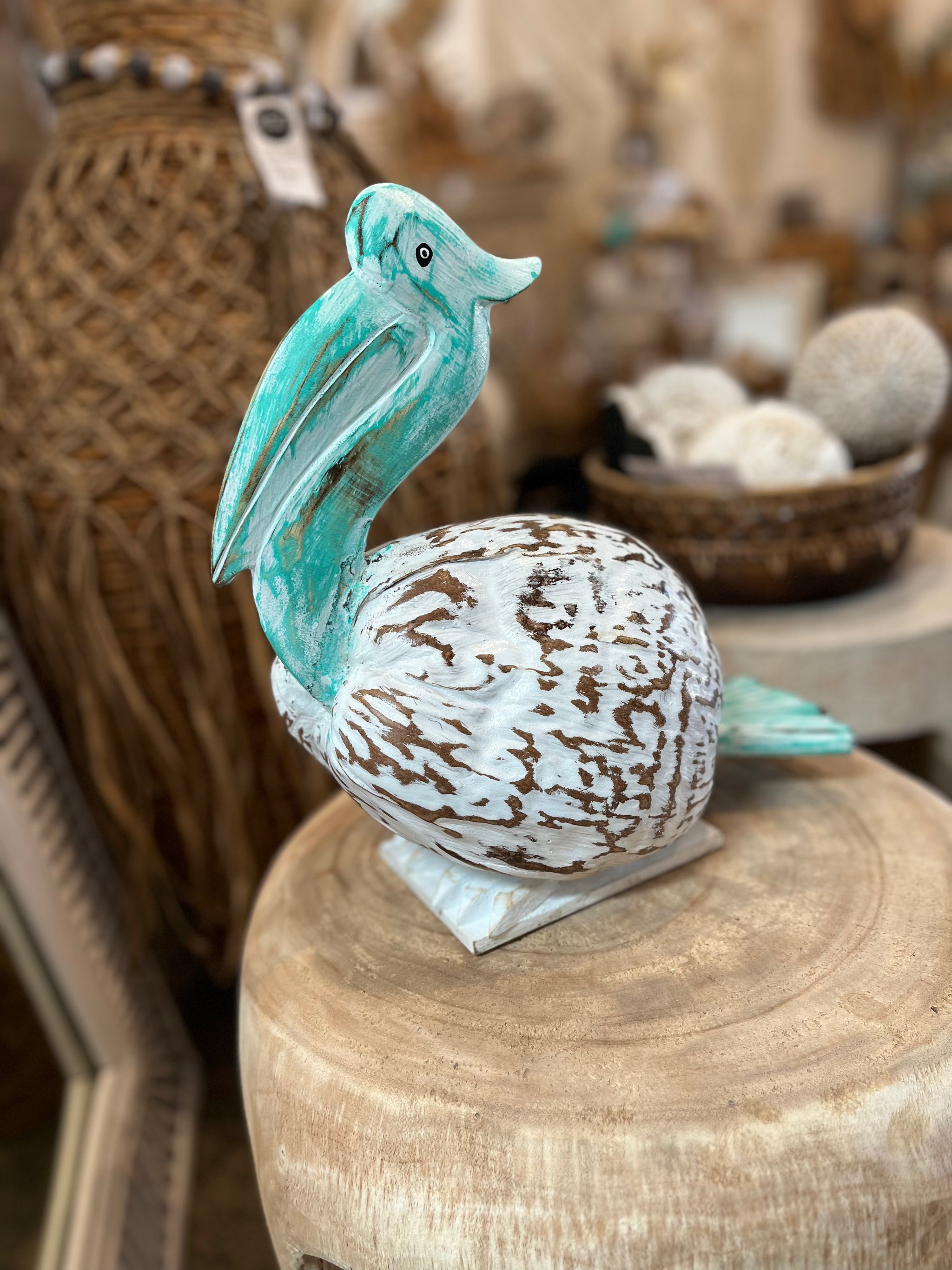 Coconut Pelican on stand. Turquoise/ white