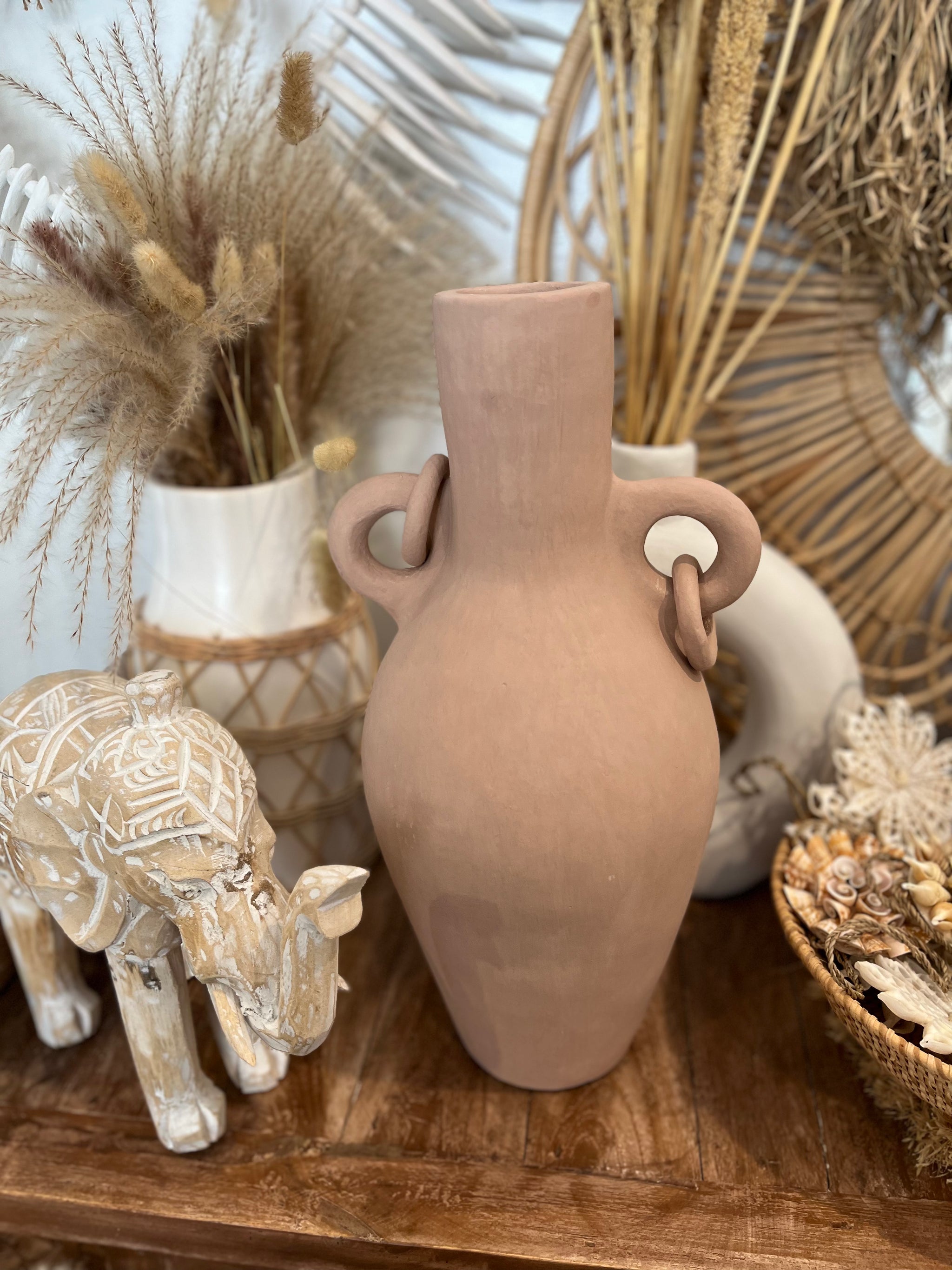 Salmon pink terracotta vase with ring handle detail