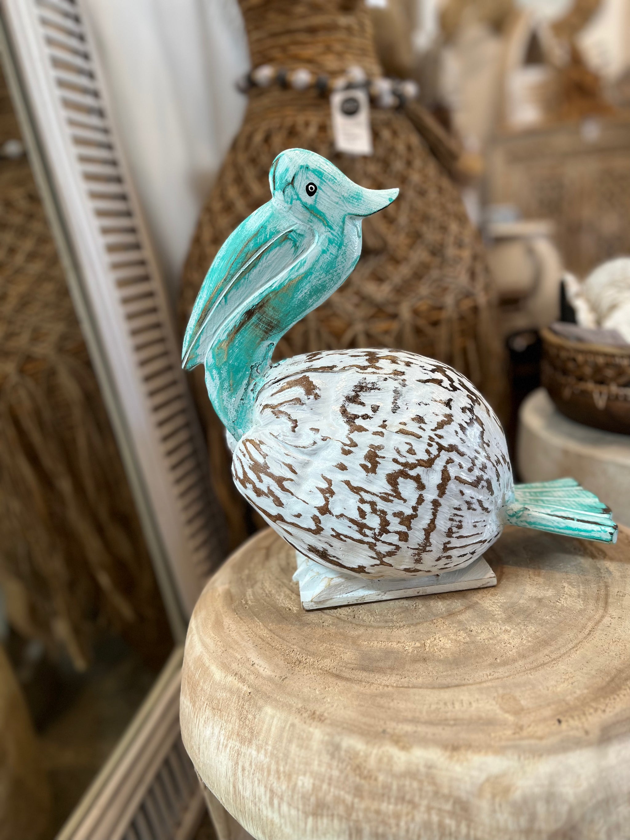 Coconut Pelican on stand. Turquoise/ white