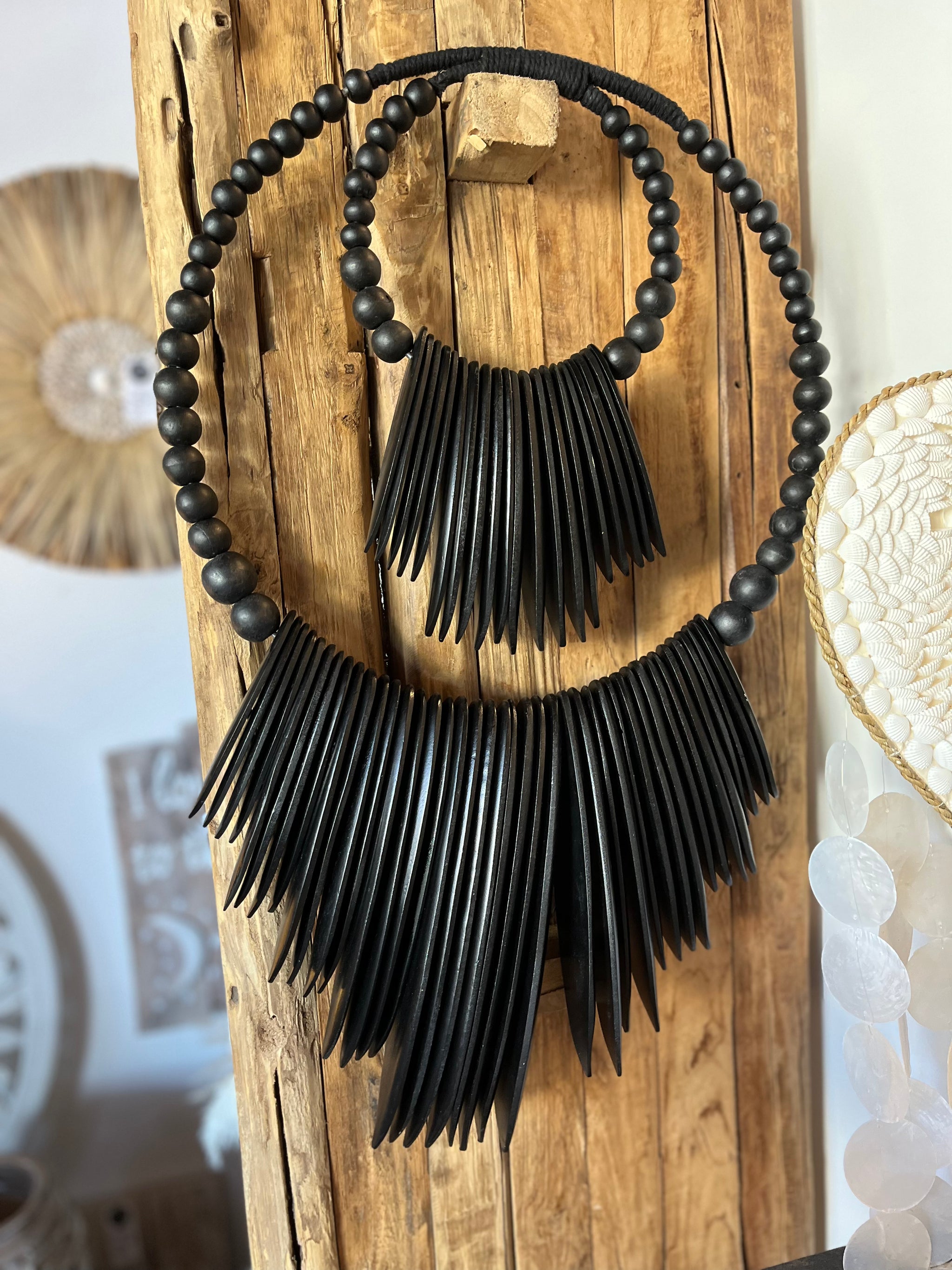 Black 2 tier wall hanging. Timber.