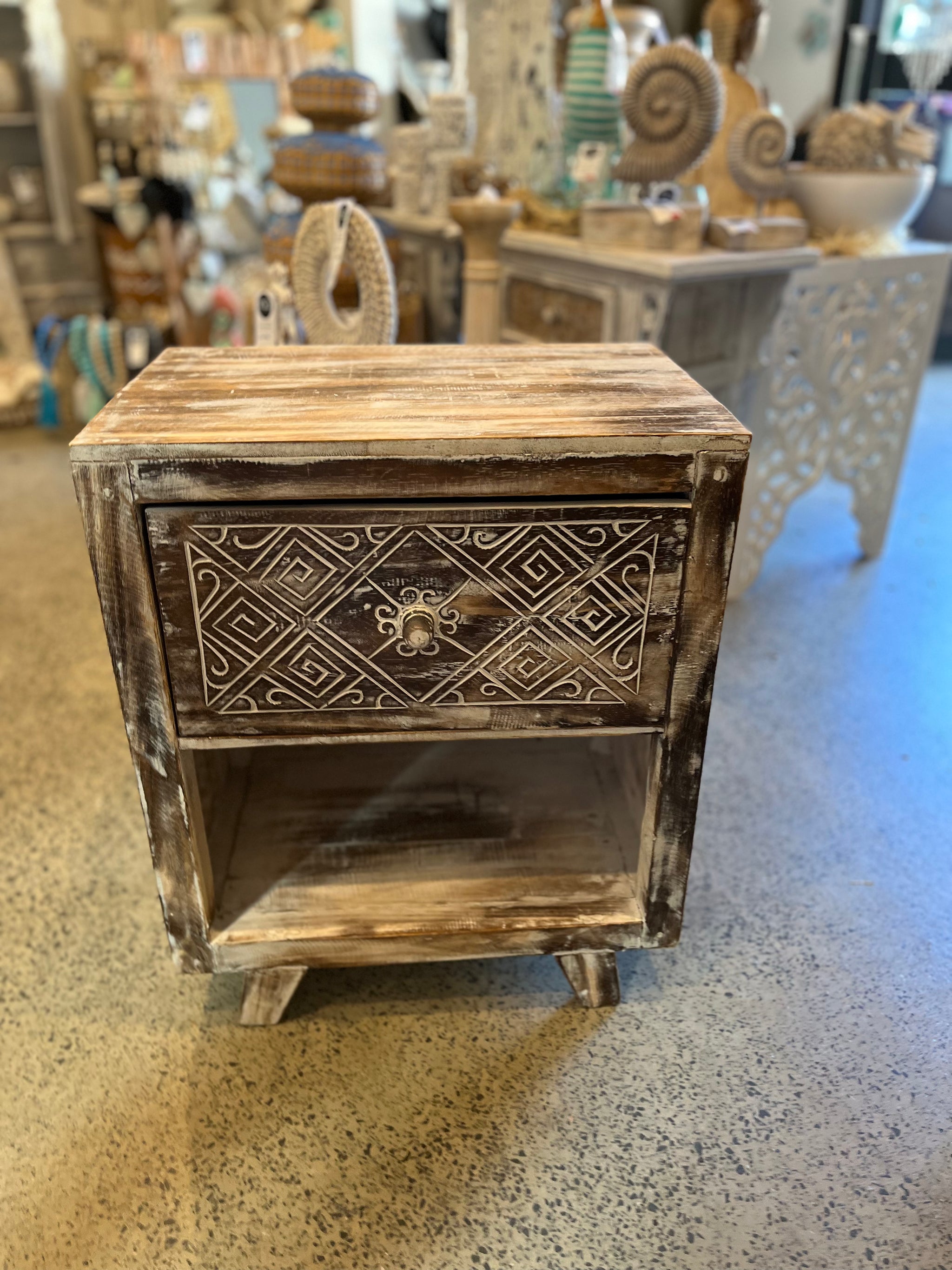 Rustic brown timber bedside with handcarved detailed drawer