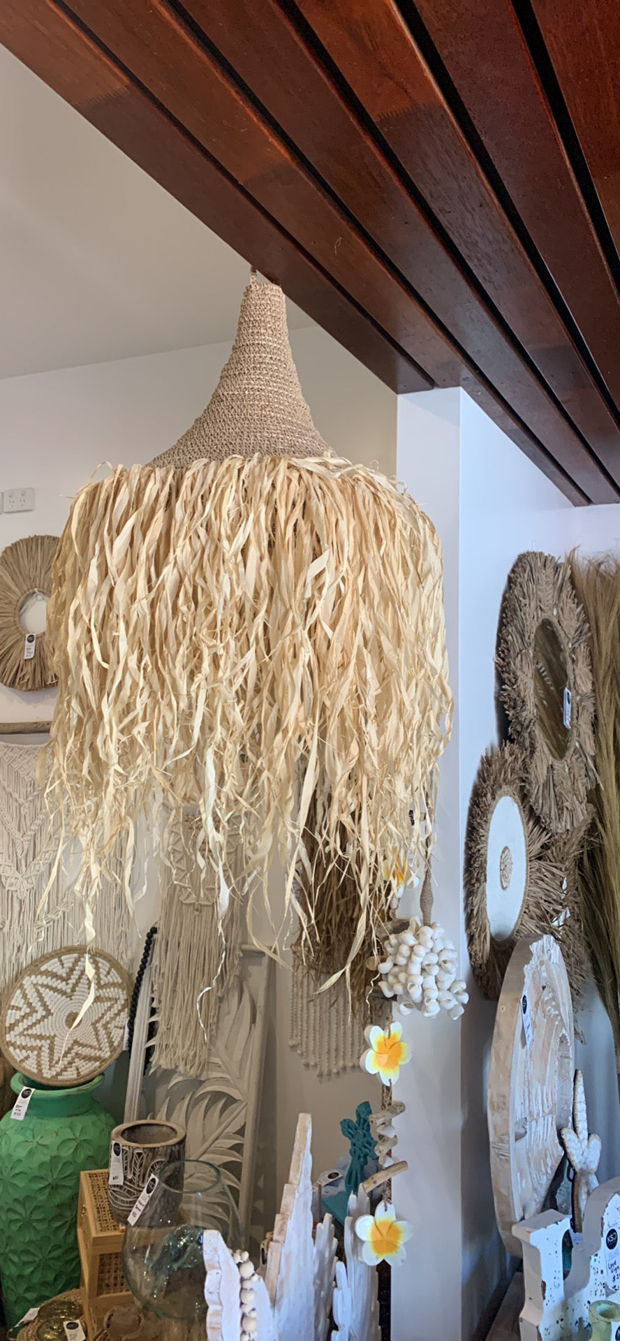 Woven light pendant with raffia