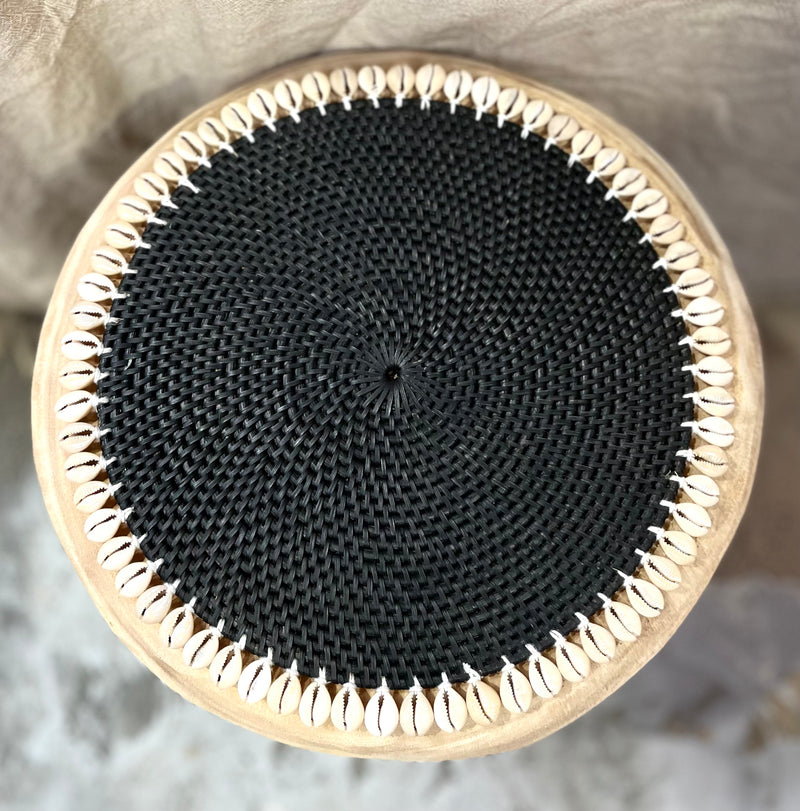 Black rattan placemat with cowrie shells