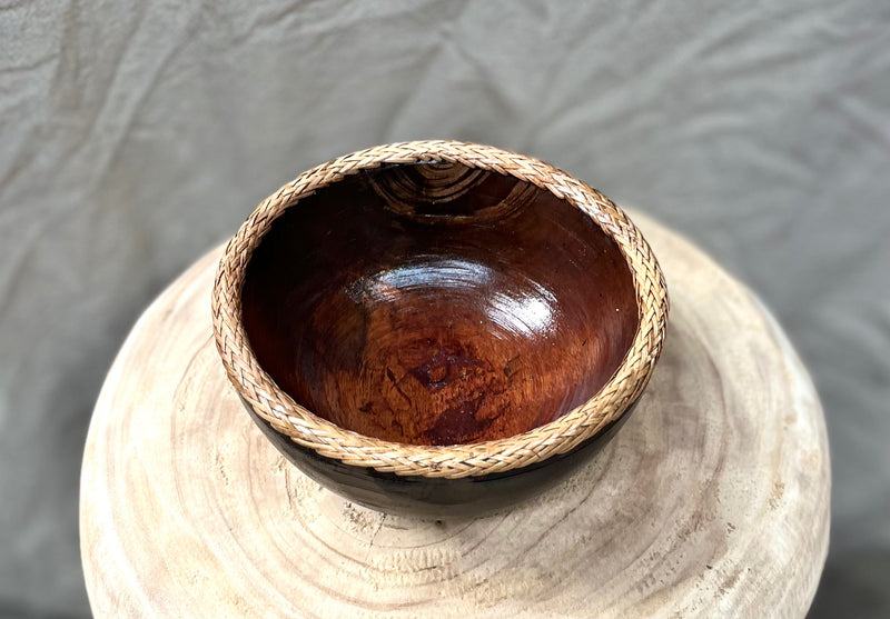 Brown timber bowl with rattan edge detail. S