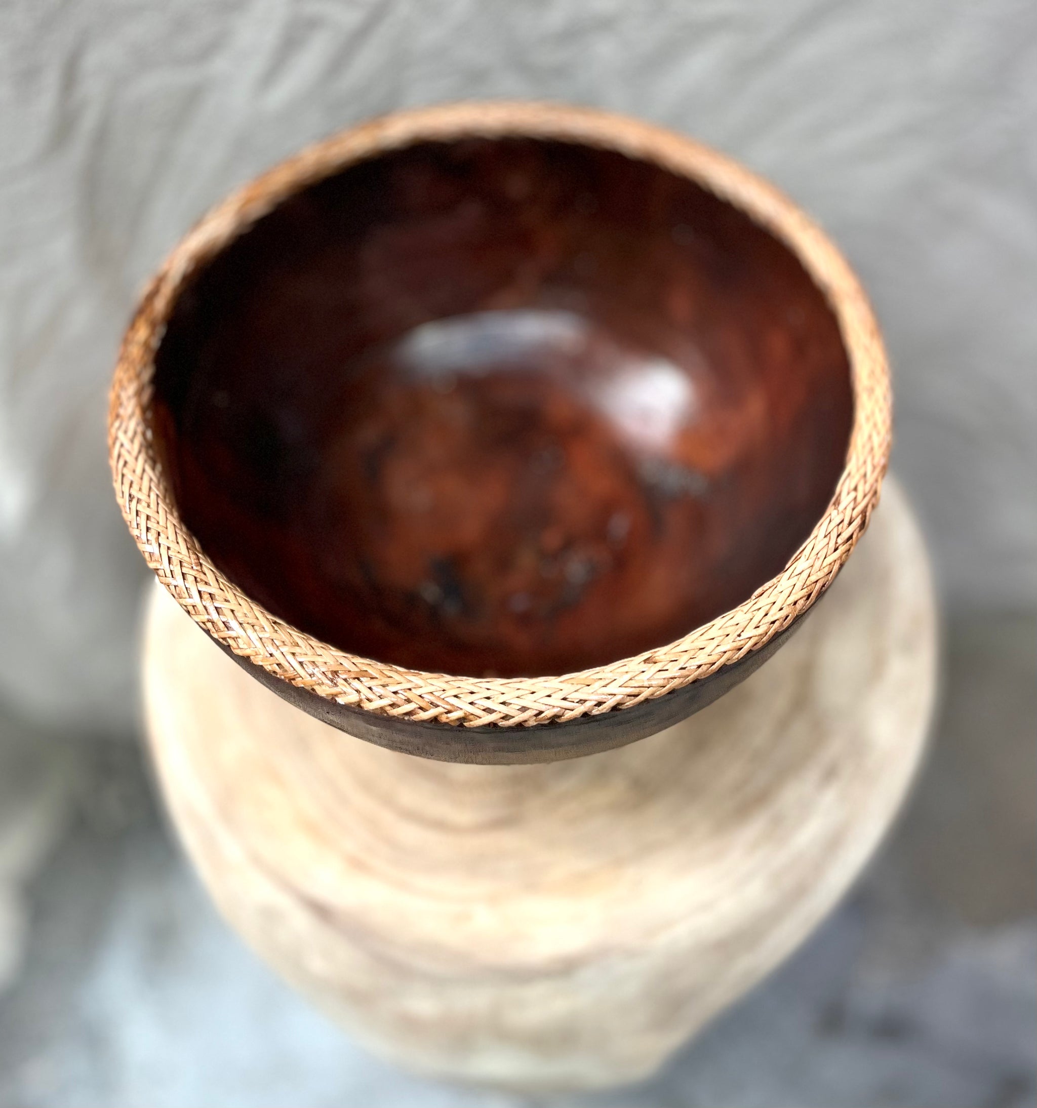 Brown timber bowl with rattan edge detail. L