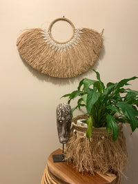 Wall hanging with white shells