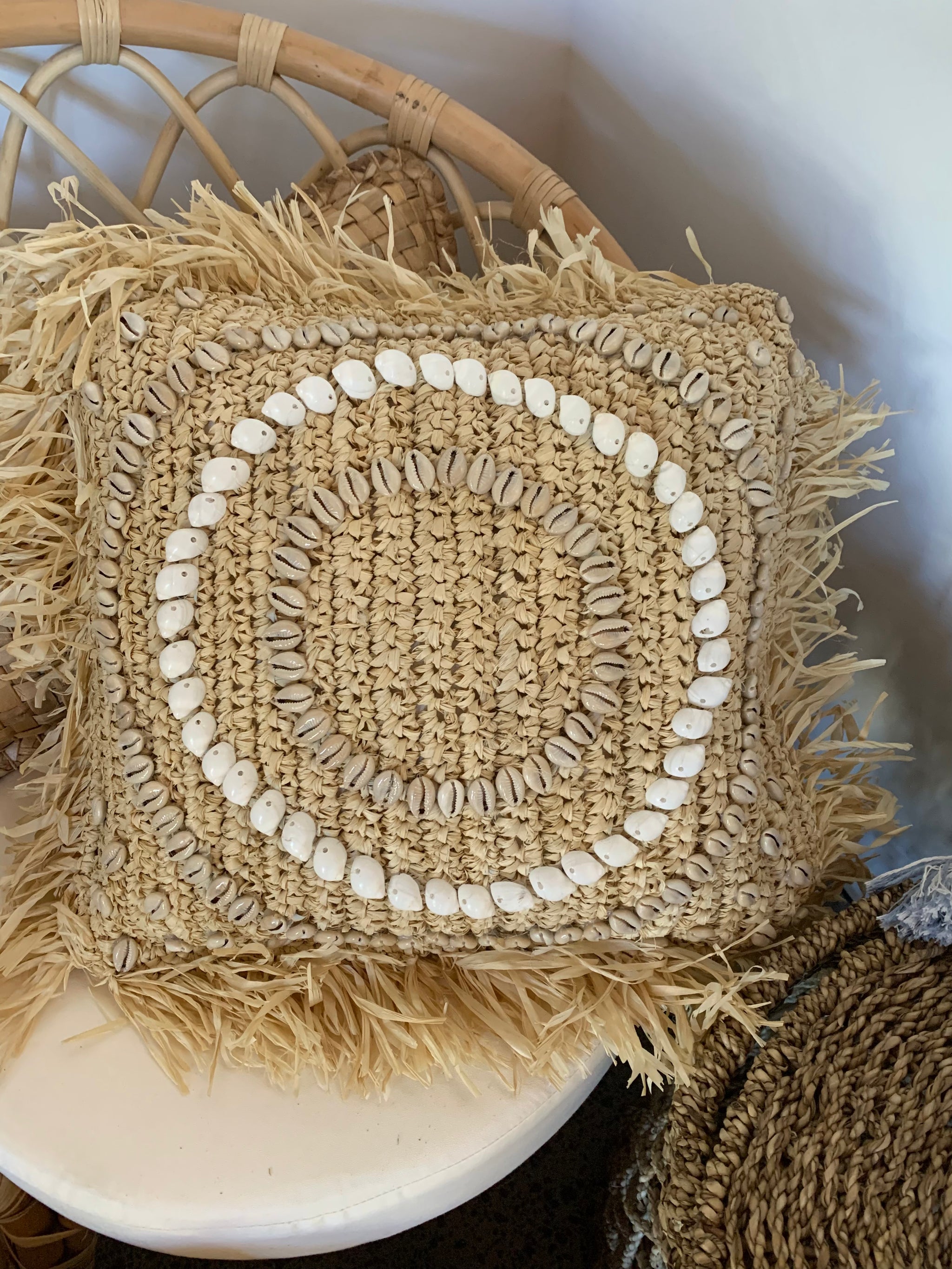 Square raffia cushion and insert with shell design