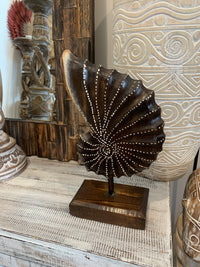 Carved timber shell on stand. Brown. Design 2. M