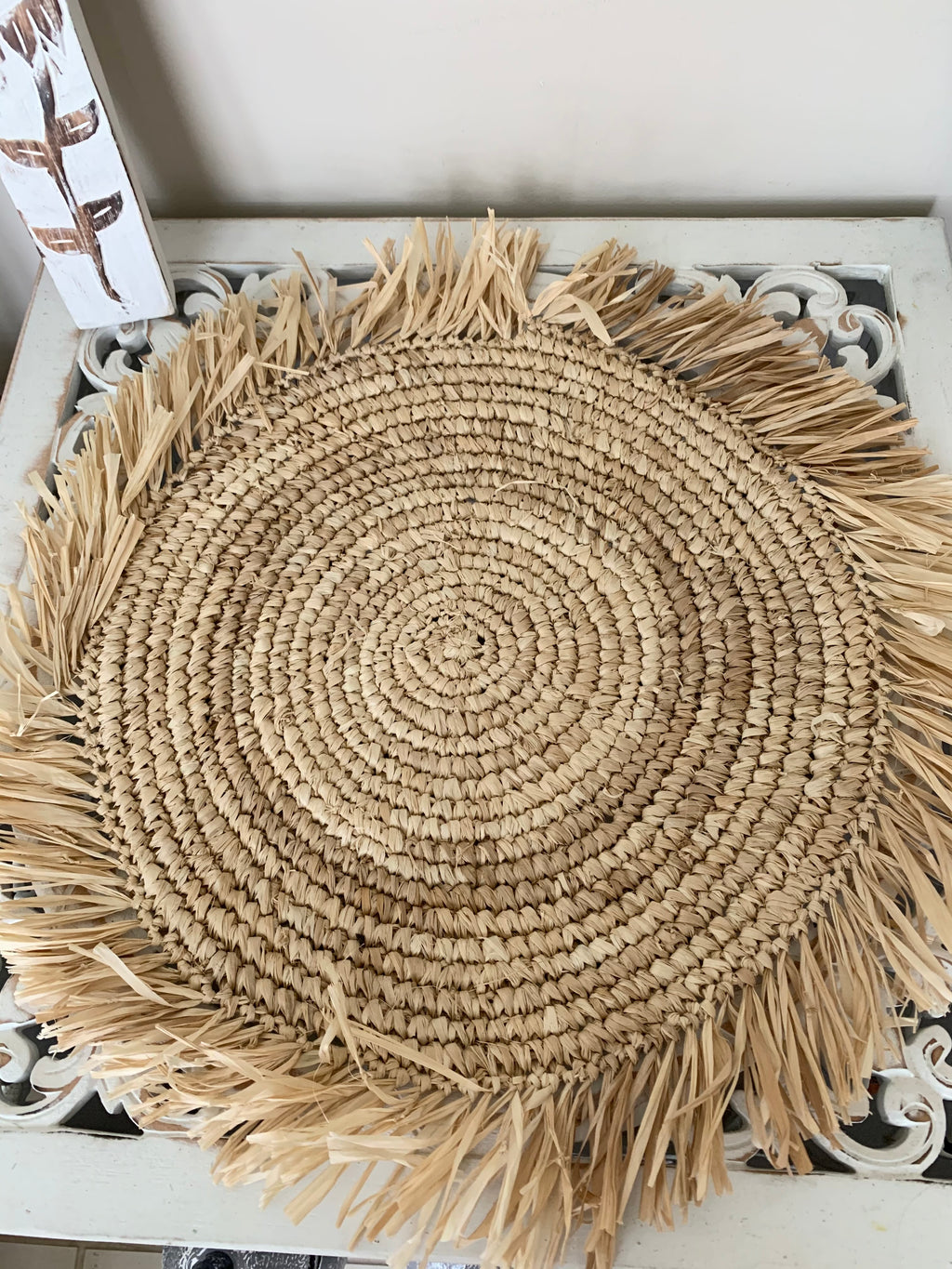 Raffia placemat with fringe. 45cm