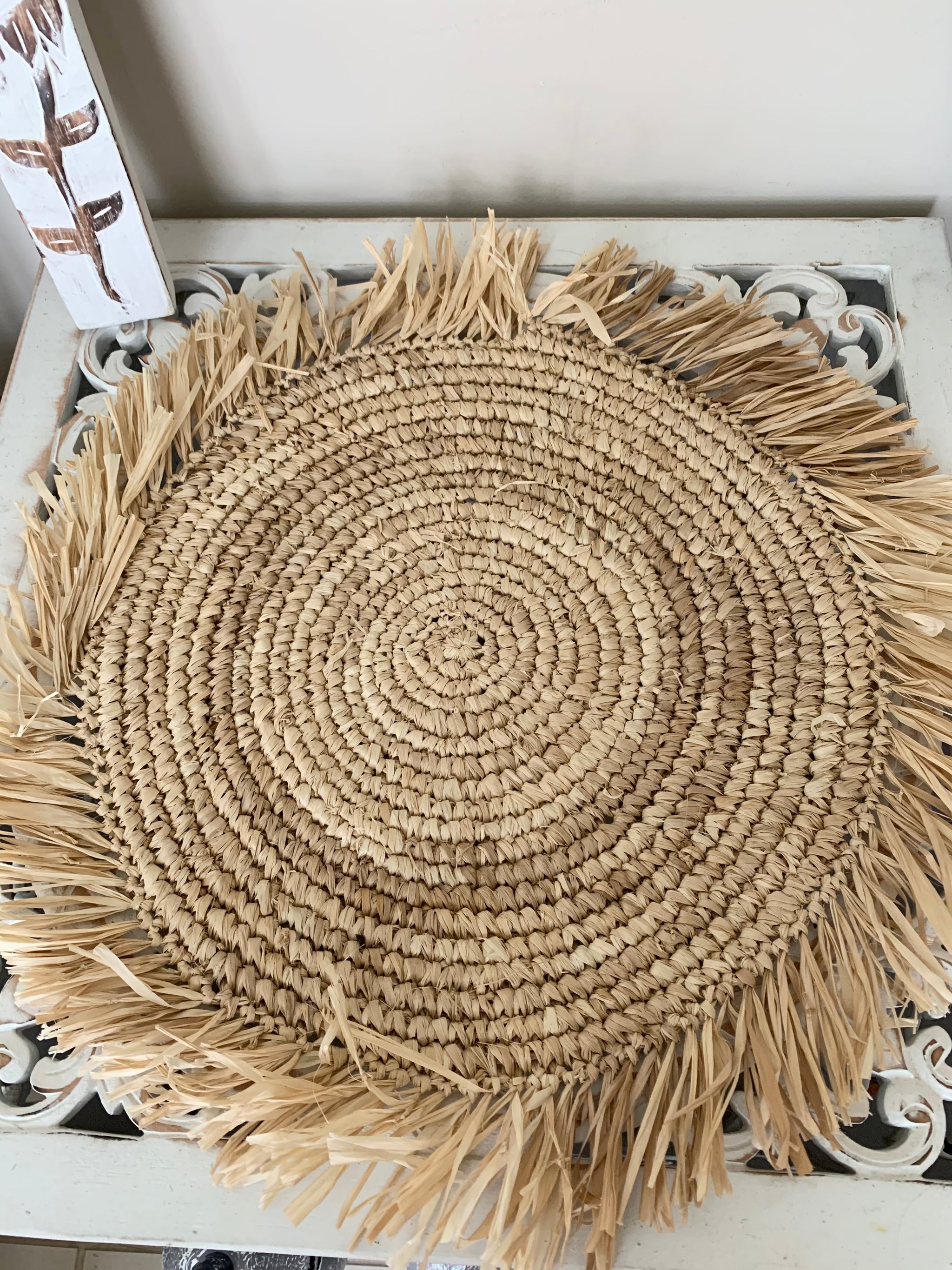 Raffia placemat with fringe. 45cm