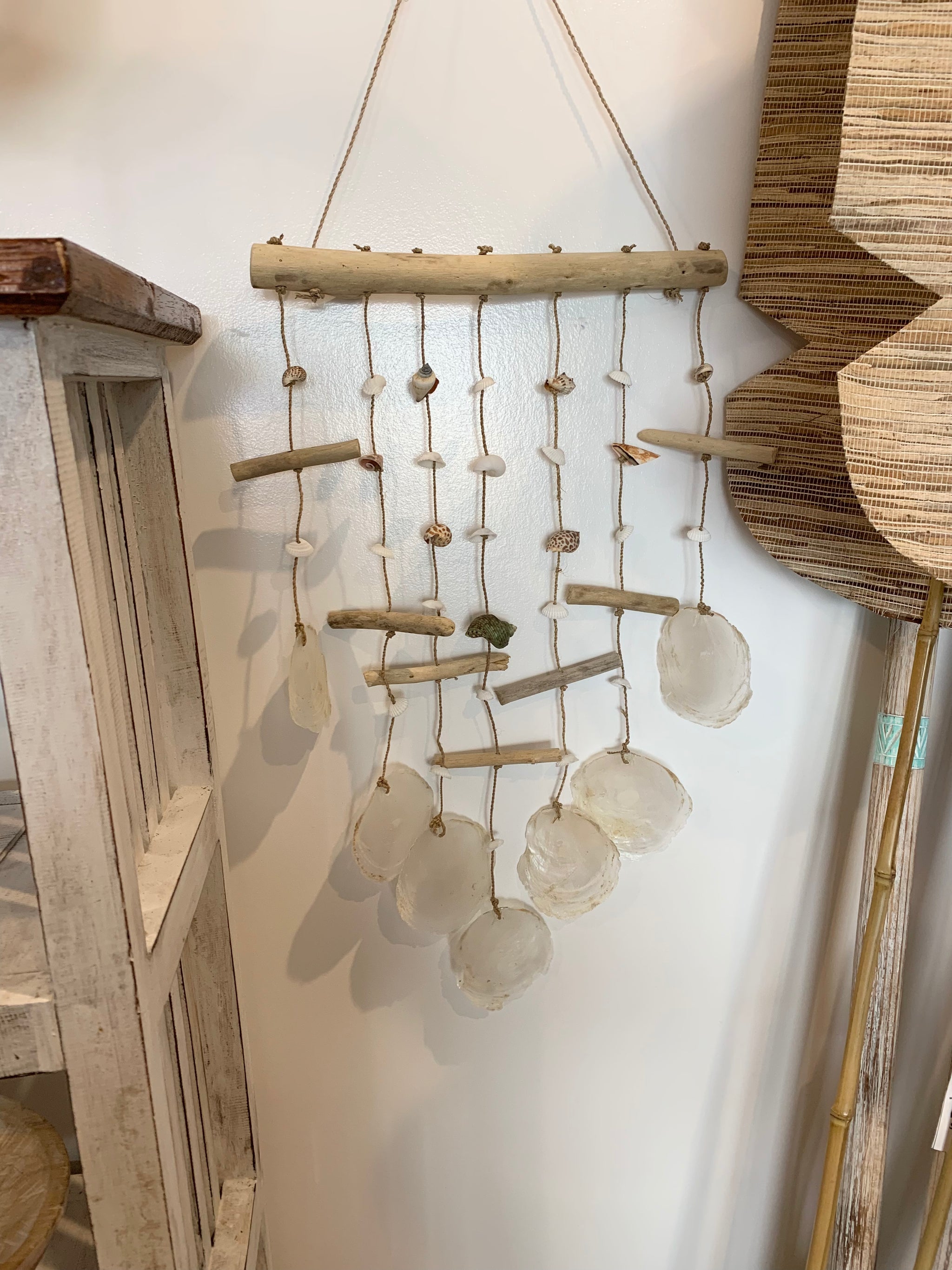 Shell wall hanging on timber stick