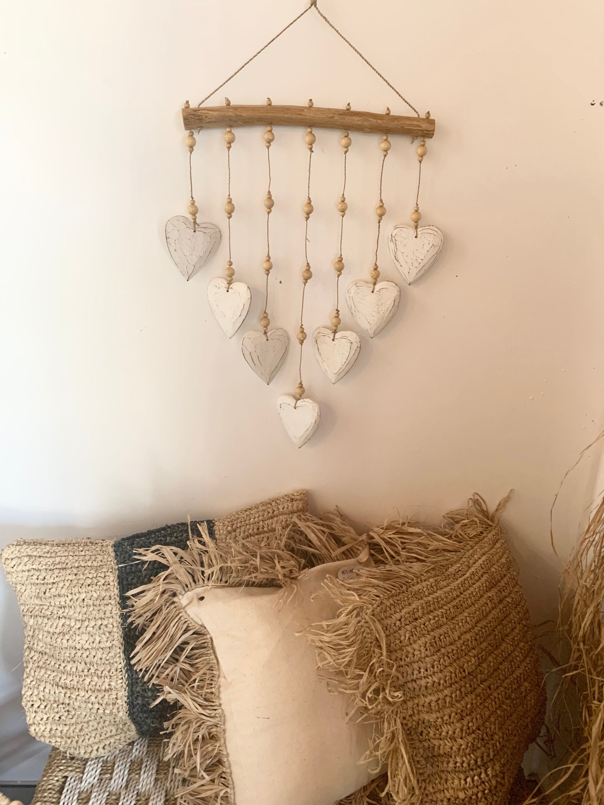 Timber white hearts hanging.