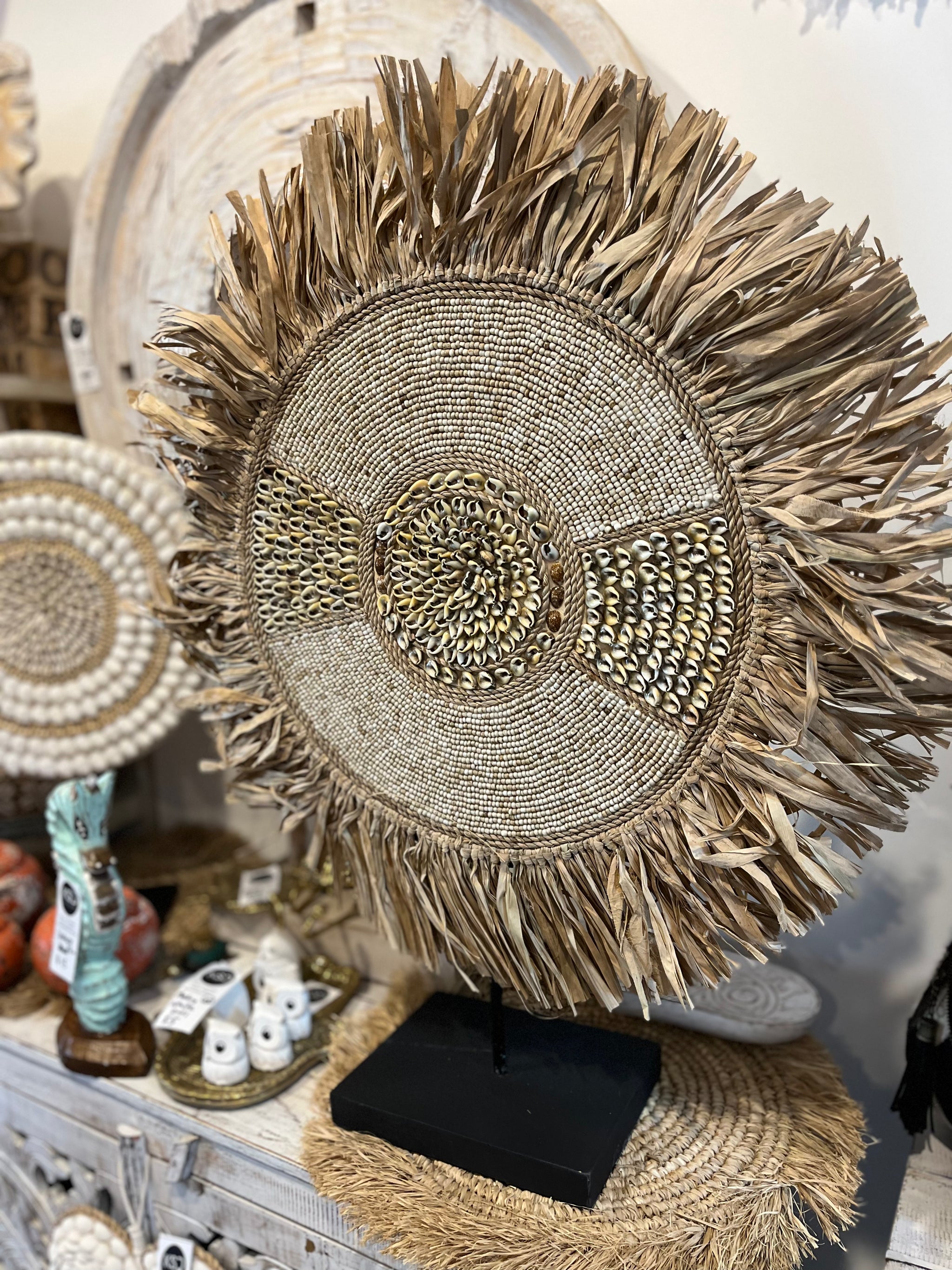 Raffia and shell decoration / juju on stand