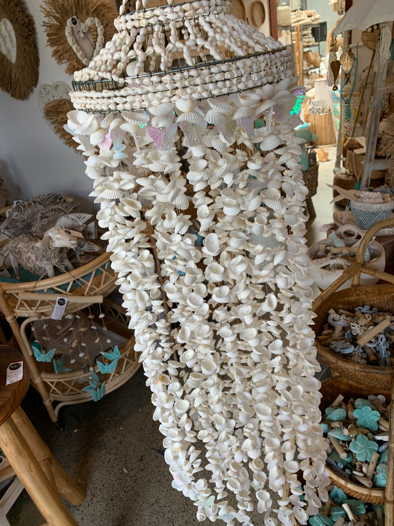 Large white shell and butterfly mobile hanging