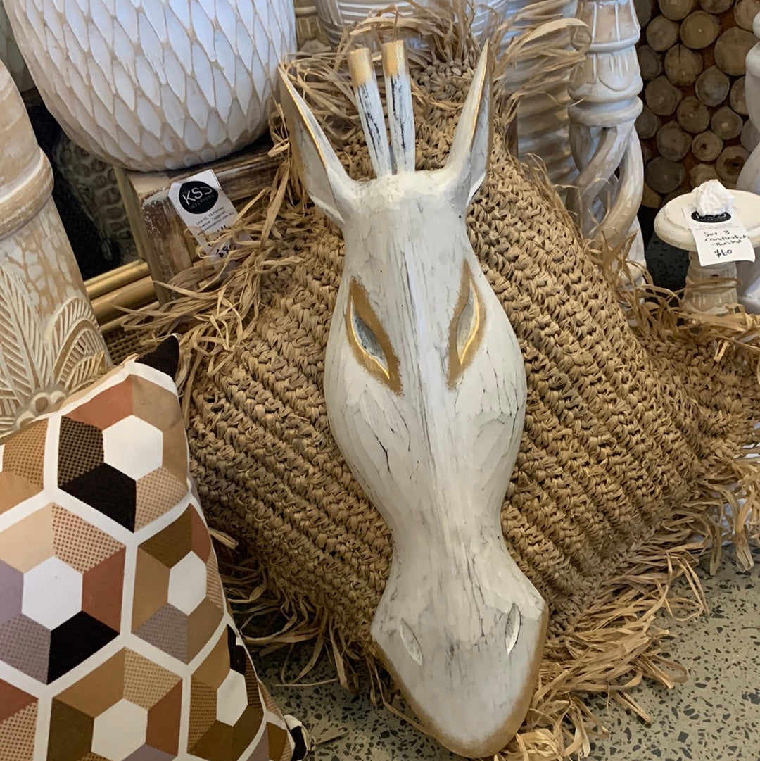 White timber giraffe mask. Wall hanging