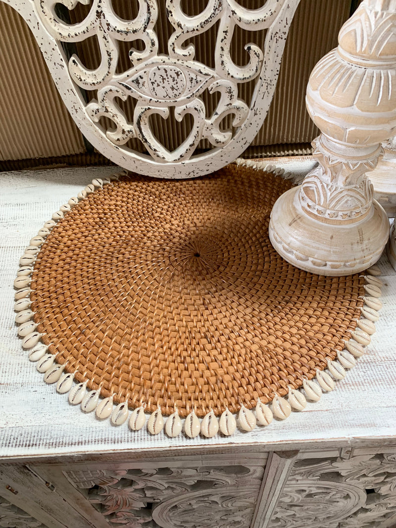 Natural rattan placemat with cowrie shells