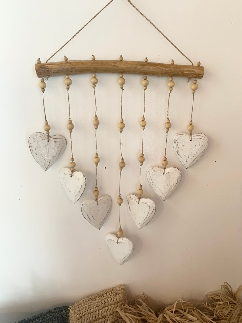 Timber white hearts hanging.