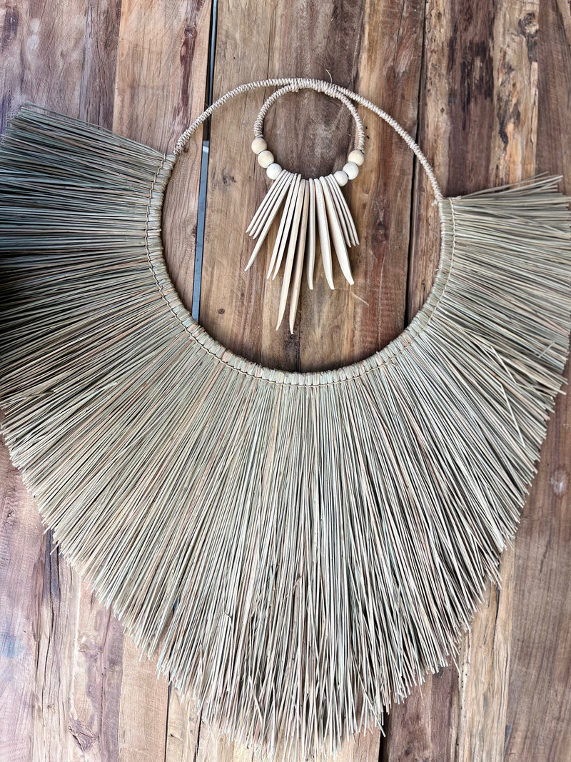 Raffia and natural timber wall hanging