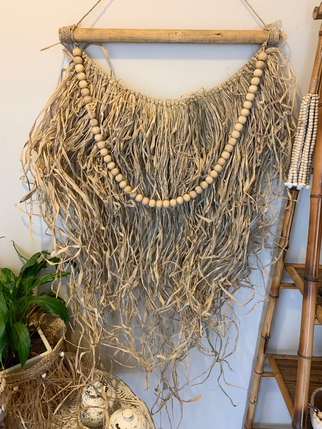 Raffia and natural bead hanging. Usually $45