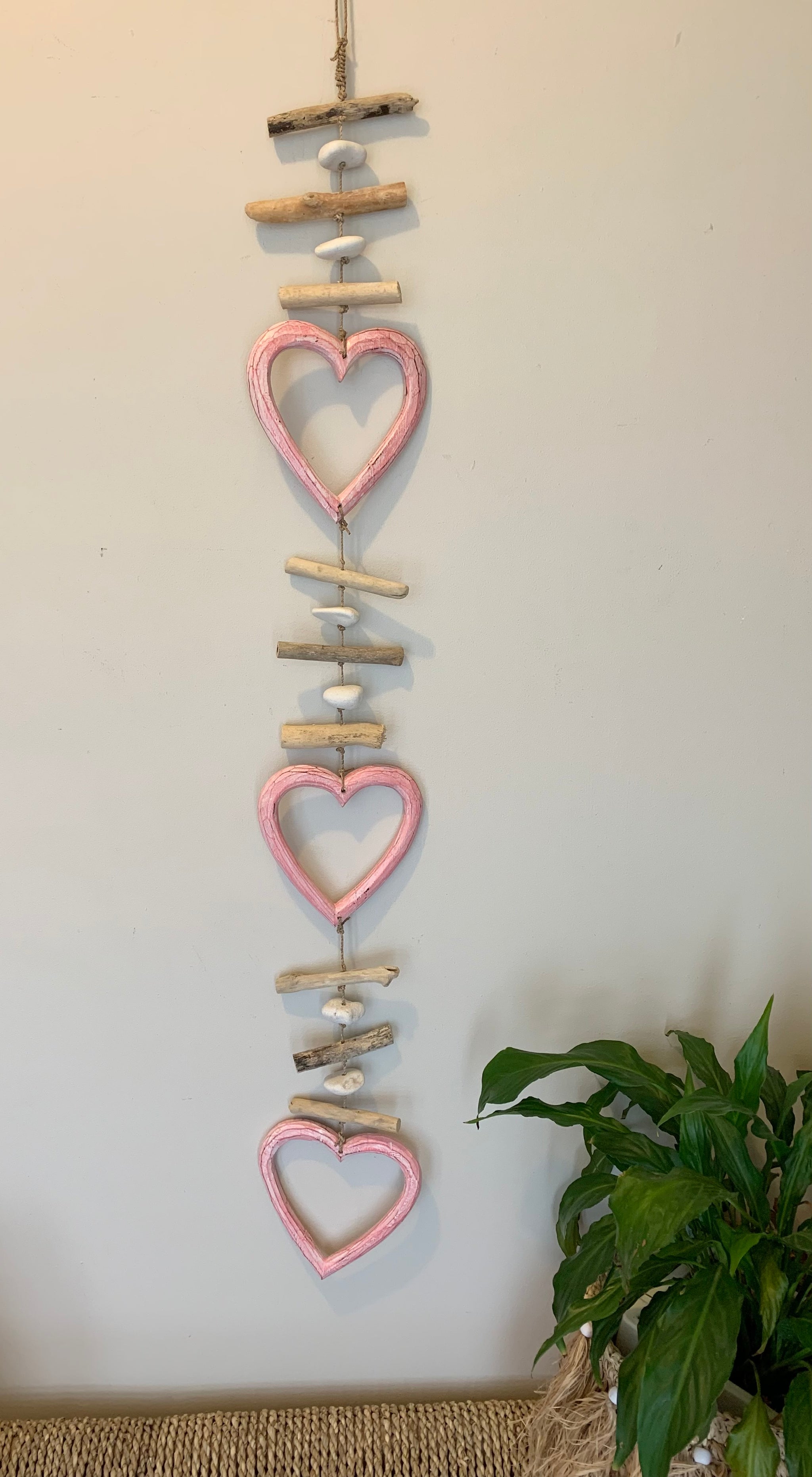 Pink timber heart hanging.