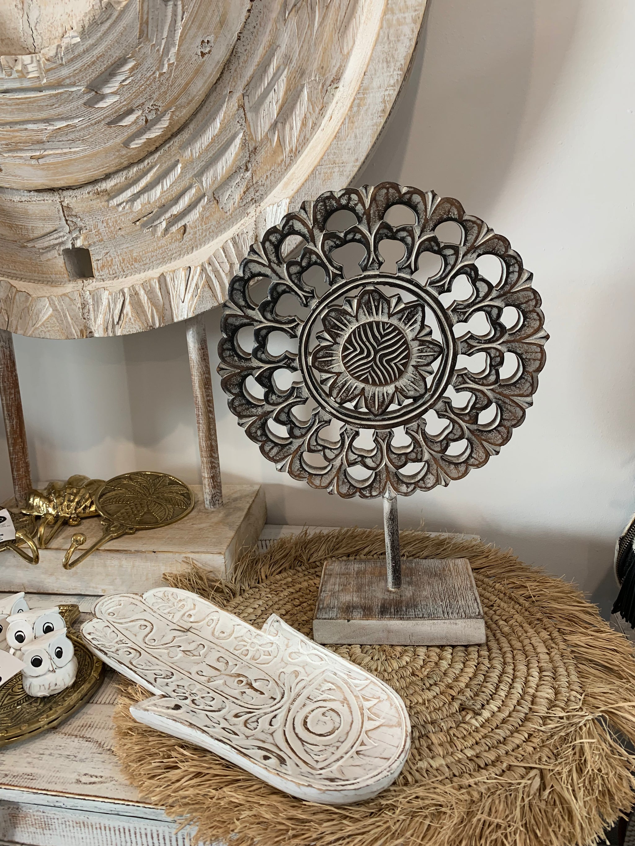 Handcarved decorative flower/ coin on stand. Brown. L