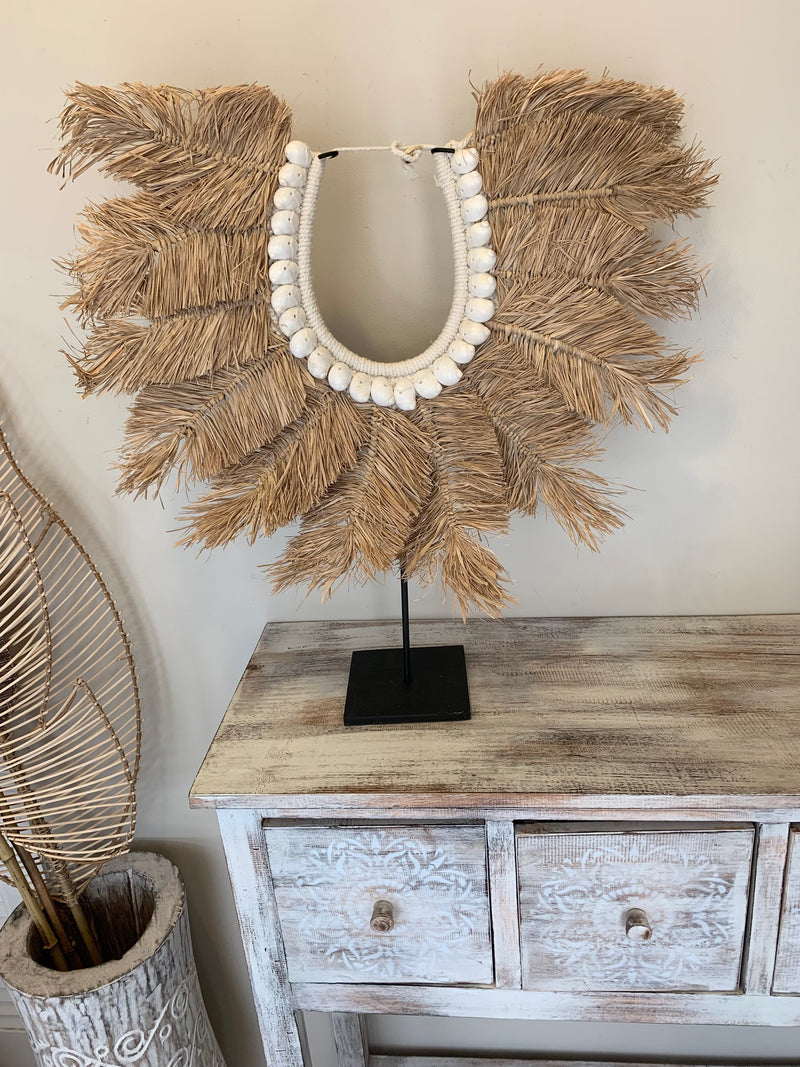 Raffia feather decoration on stand