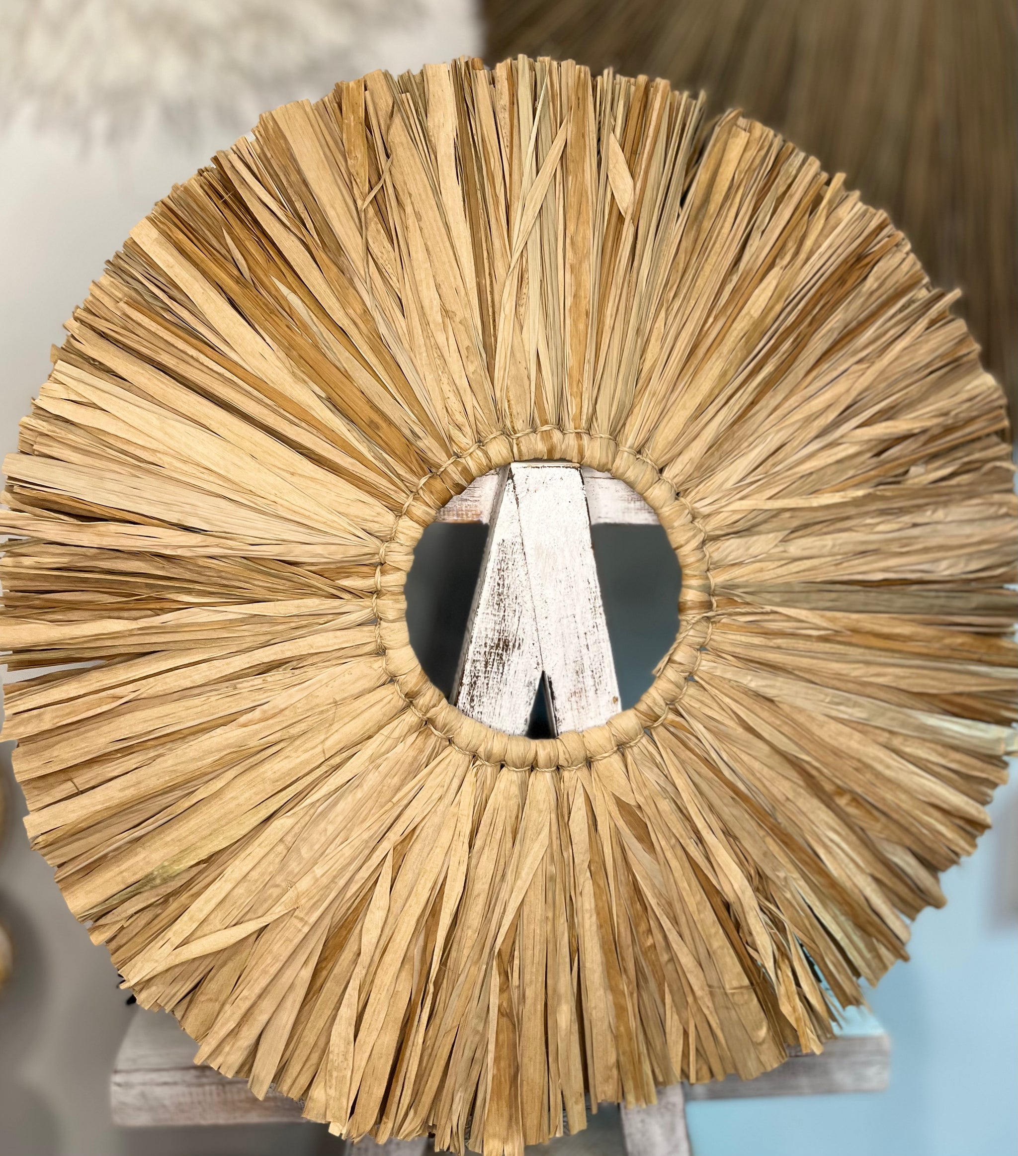 Round raffia wall hanging