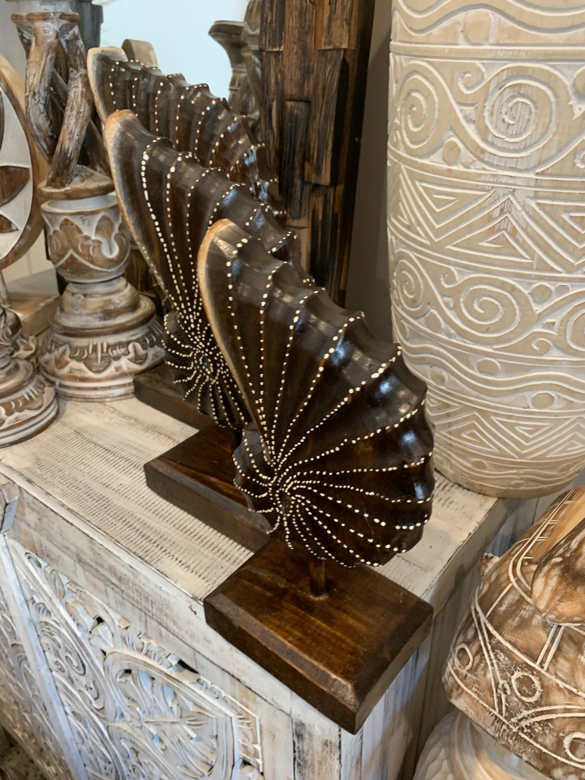 Carved timber shell on stand. Set 3. Brown. Design 2