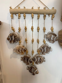 Brown carved timber fish wall hanging.