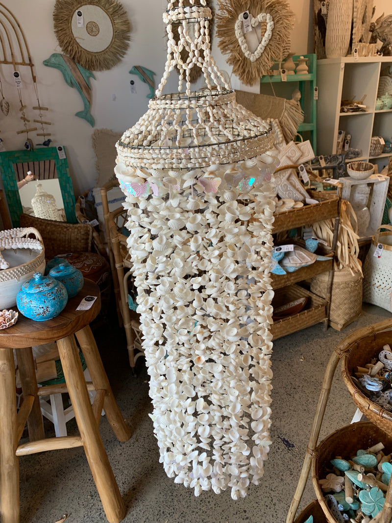 Large white shell and butterfly mobile hanging