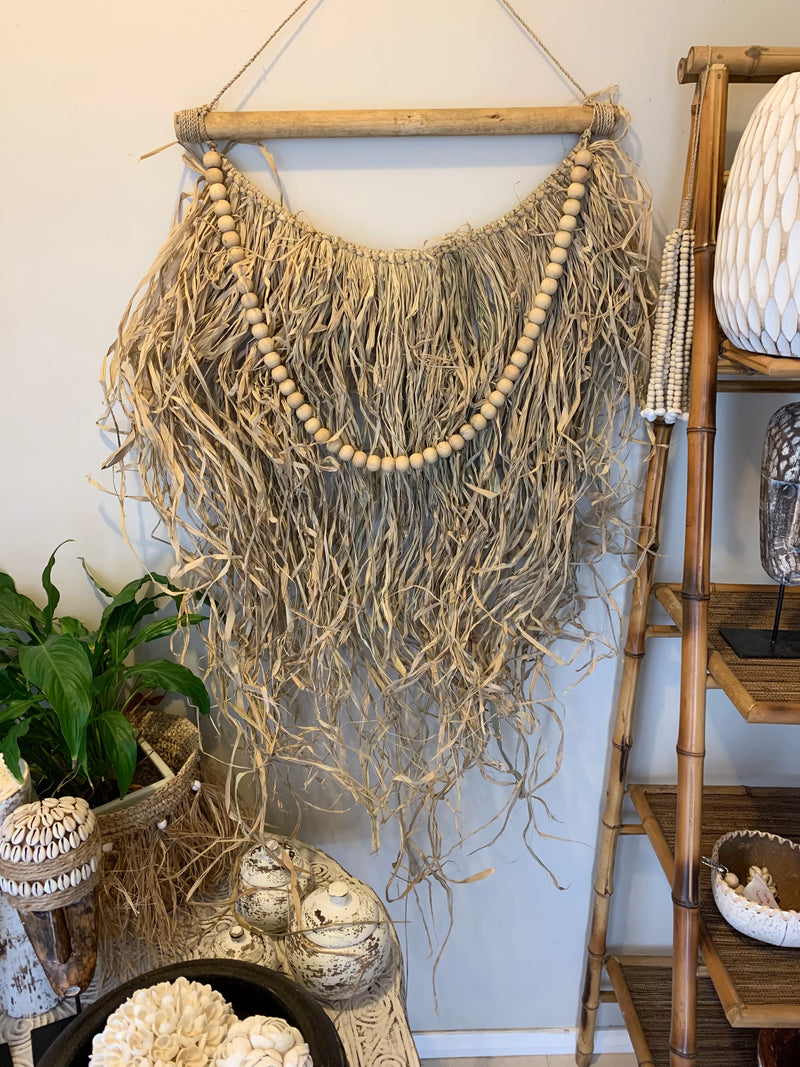 Raffia and natural bead hanging. Usually $45