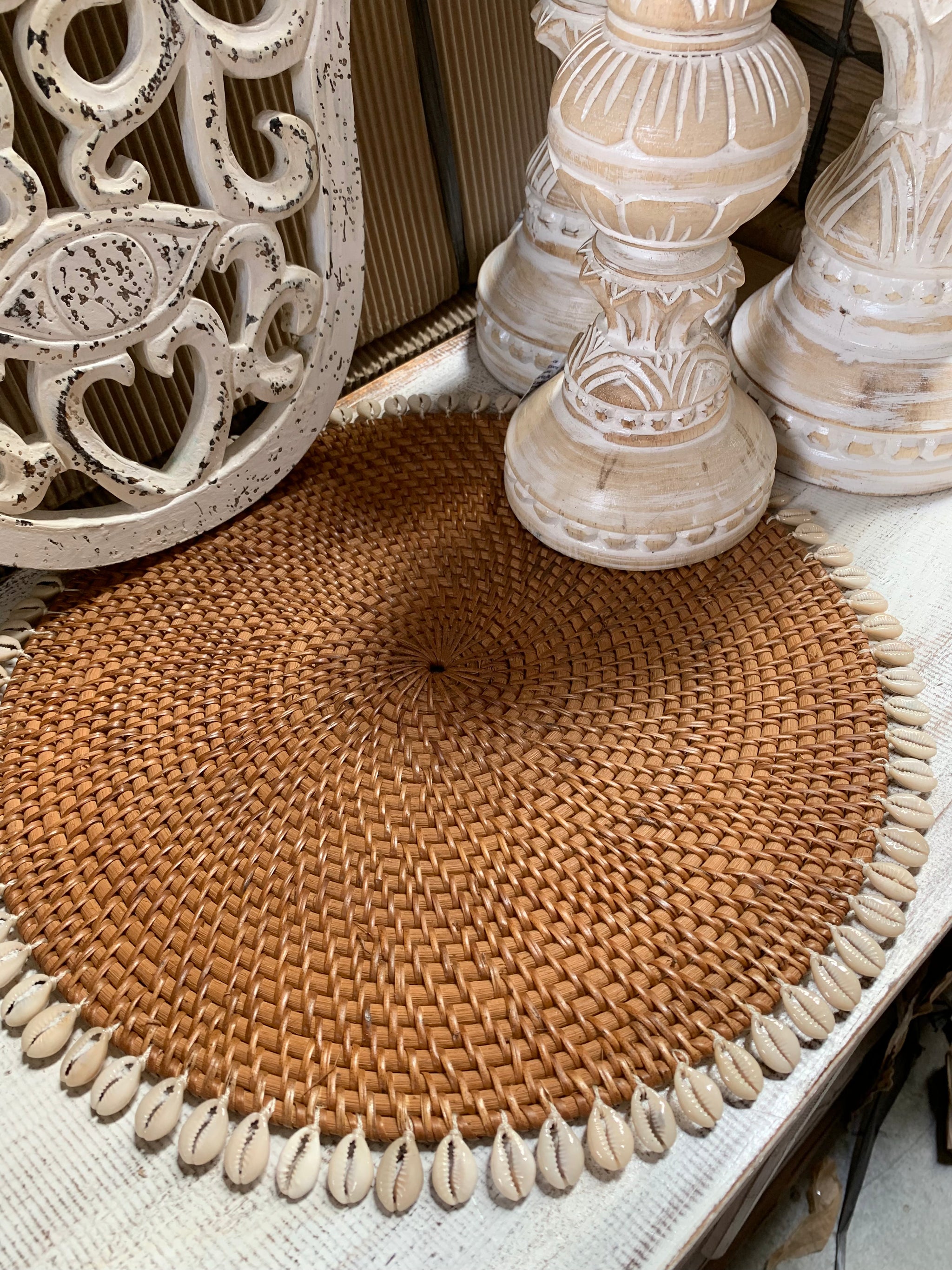 Natural rattan placemat with cowrie shells