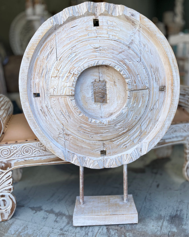 Timber coin decoration on stand