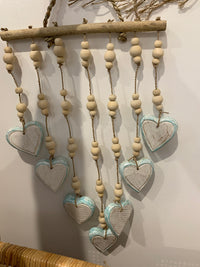 Turquoise blue heart hanging.