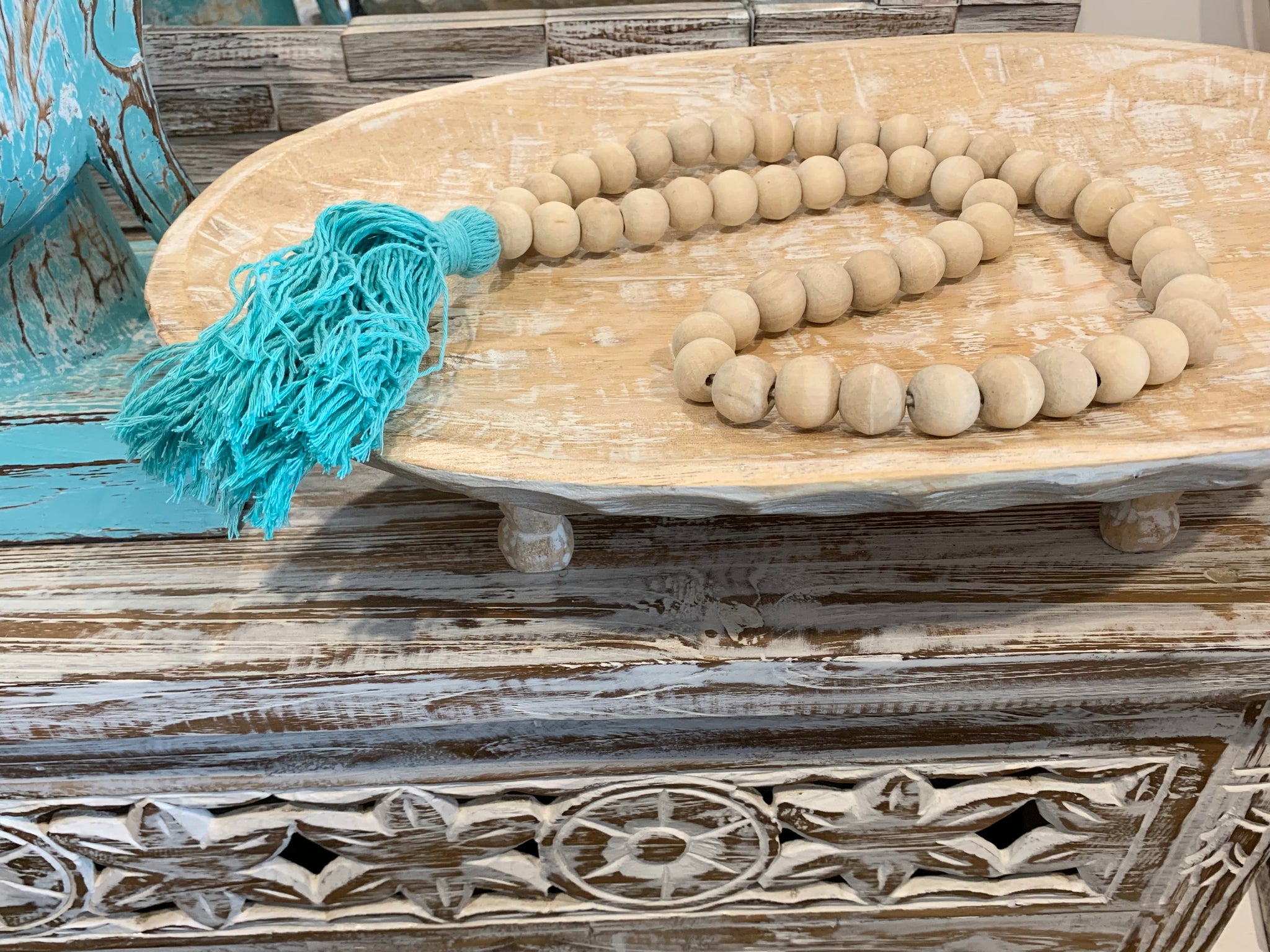 Natural bead and blue tassel hanging.