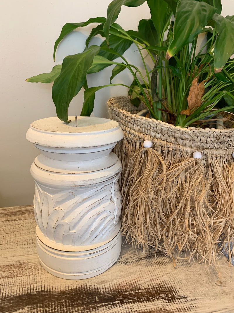 Large white rustic candle holder.