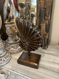 Carved timber shell on stand. Brown. Design 2. S