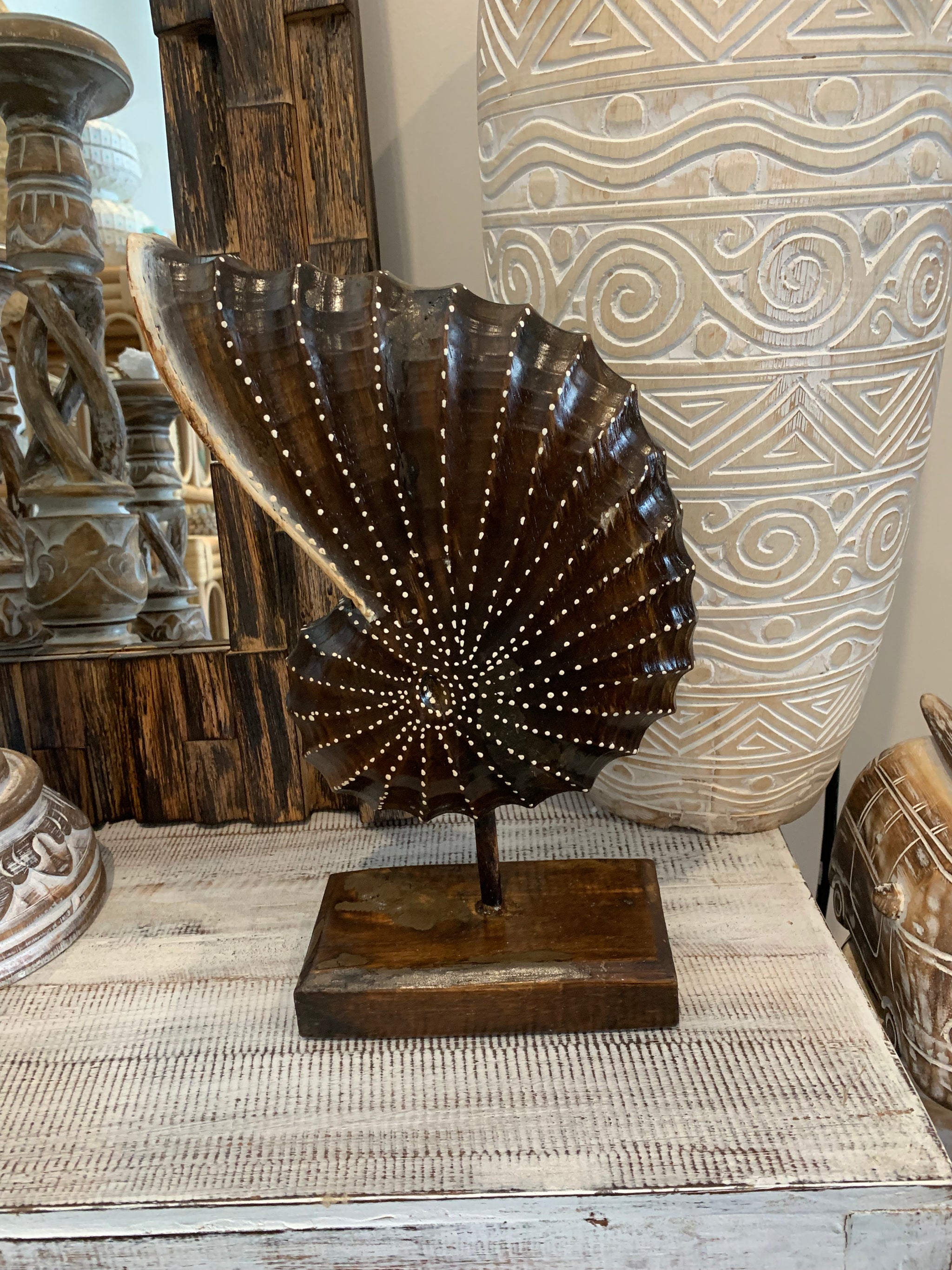 Carved timber shell on stand. Brown. Design 2. L