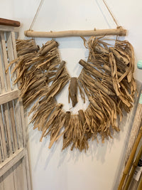 Raffia and timber wall hanging